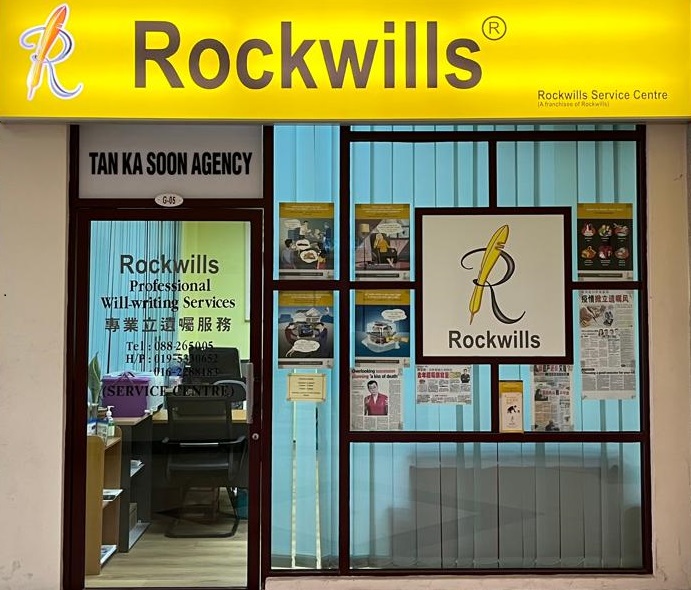Rockwills Service Centre shopfront at Menara MAA, Kota Kinabalu: yellow Rockwills sign above a glass shopfront